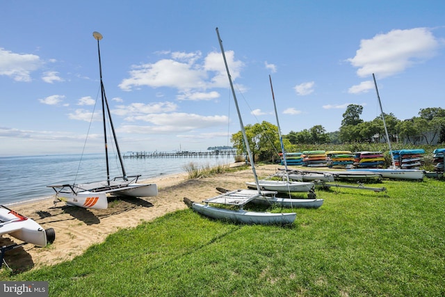 exterior space featuring a water view and a lawn