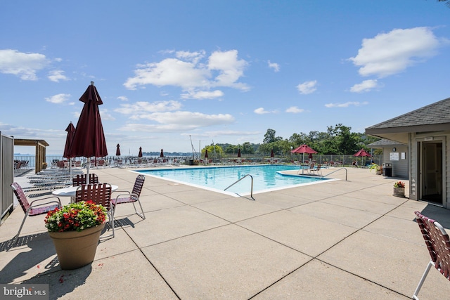 view of swimming pool with a patio