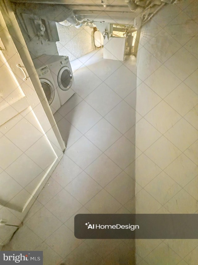 bathroom featuring washing machine and dryer, tile walls, and tile patterned floors