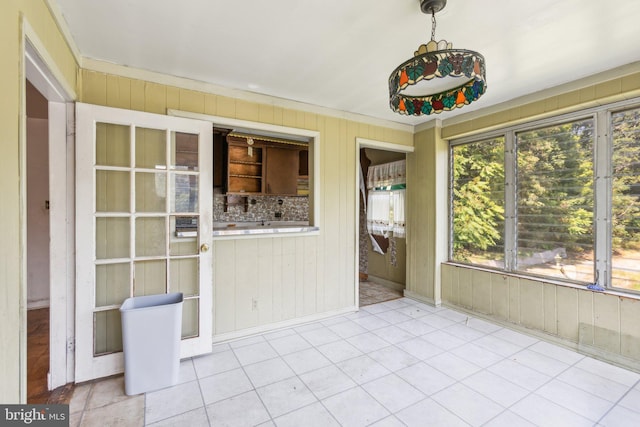 unfurnished sunroom featuring plenty of natural light