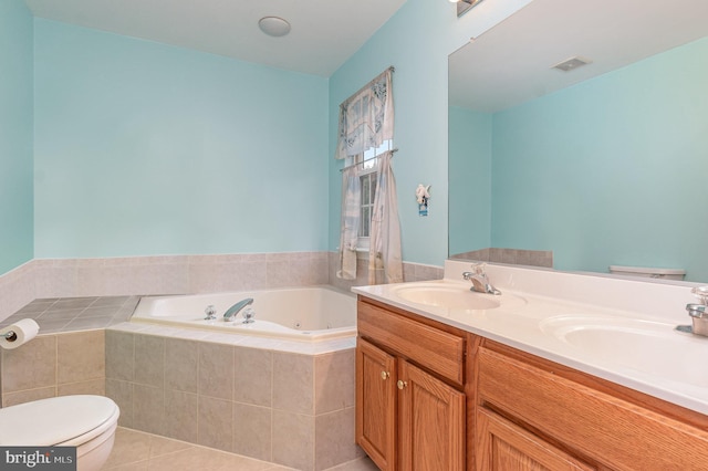 bathroom with double vanity, a garden tub, visible vents, and a sink