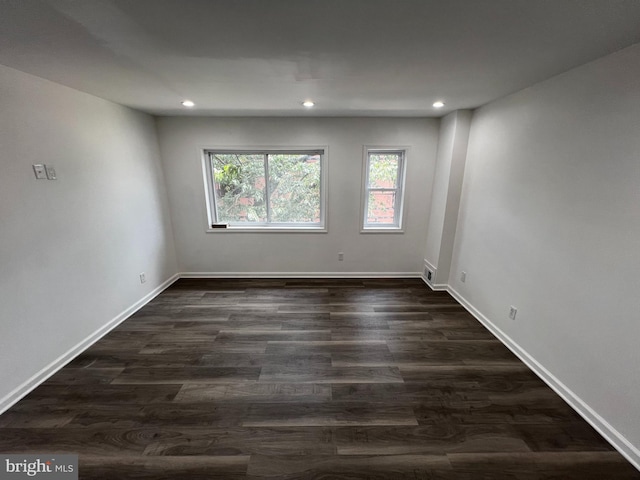 empty room featuring wood-type flooring