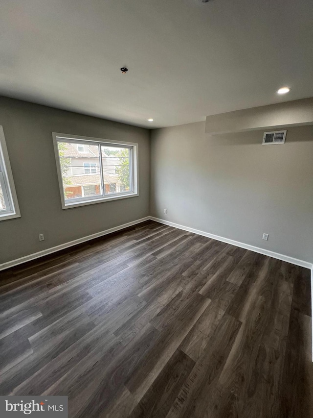 spare room with hardwood / wood-style flooring