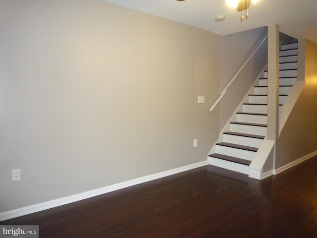 staircase featuring hardwood / wood-style flooring