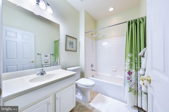 full bathroom featuring vanity, toilet, shower / bath combination with curtain, and tile patterned floors