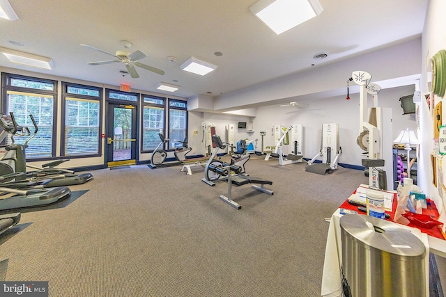 exercise room featuring carpet flooring and ceiling fan