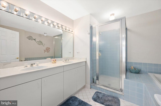 bathroom featuring vanity, separate shower and tub, and tile patterned floors