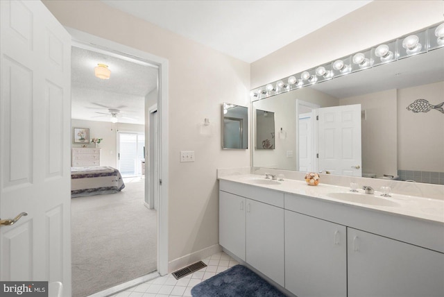 bathroom with ceiling fan and vanity