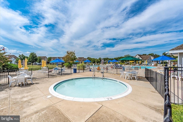 view of swimming pool featuring a patio area