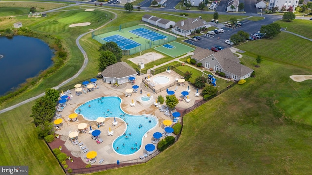 birds eye view of property featuring a water view