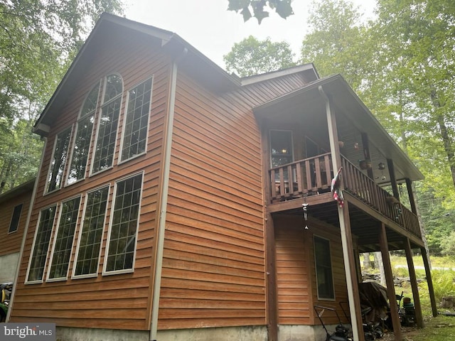 view of side of property with a balcony