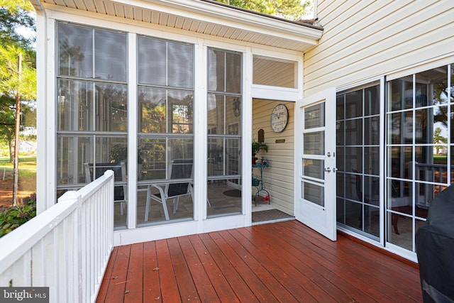 deck with a sunroom