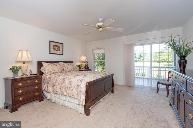 bedroom featuring light carpet, a ceiling fan, and access to exterior