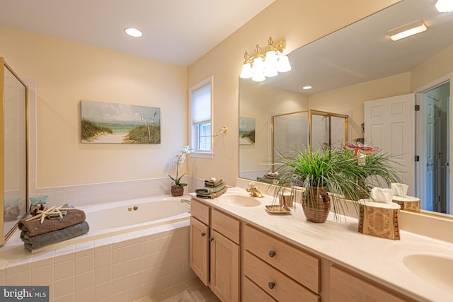 full bath featuring a sink, a shower stall, a bath, and double vanity