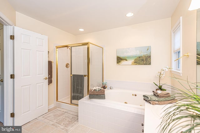 bathroom featuring a stall shower, recessed lighting, a bath, and tile patterned floors