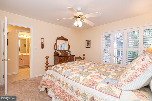 bedroom featuring light tile patterned floors, ceiling fan, baseboards, and light colored carpet