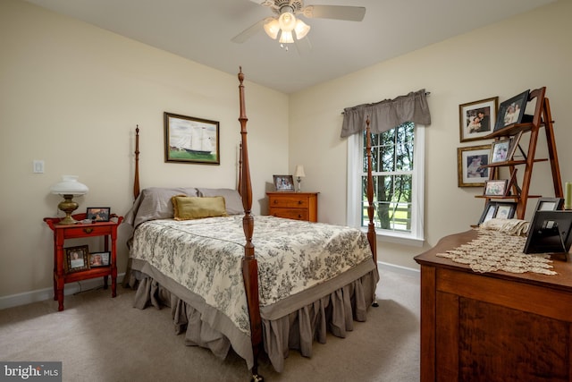 bedroom featuring light colored carpet and ceiling fan