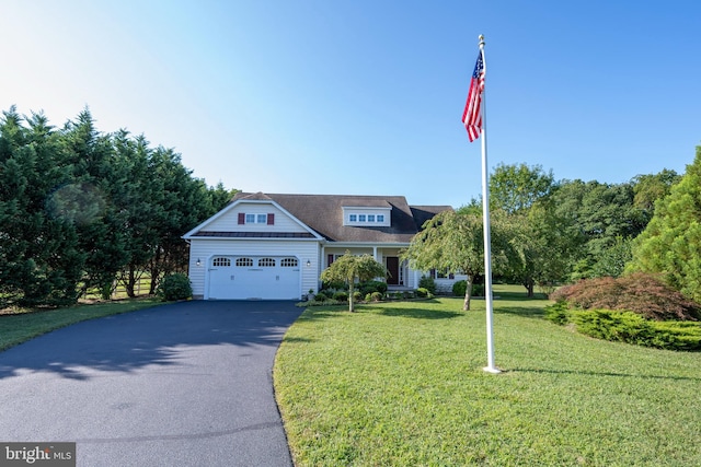 view of front facade featuring a front yard and a garage