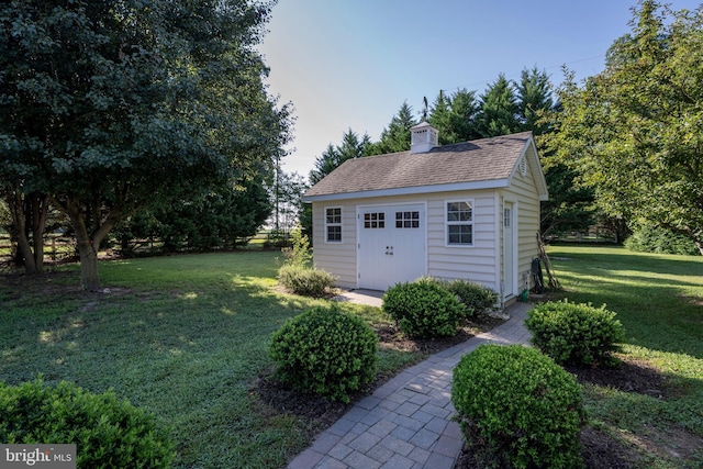 garage featuring a yard