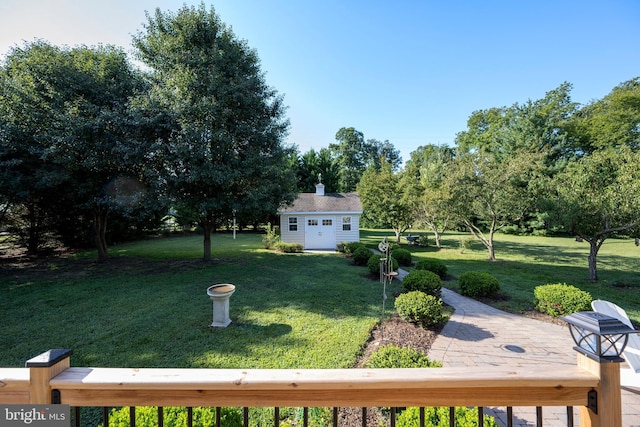 view of yard with an outdoor structure and a patio