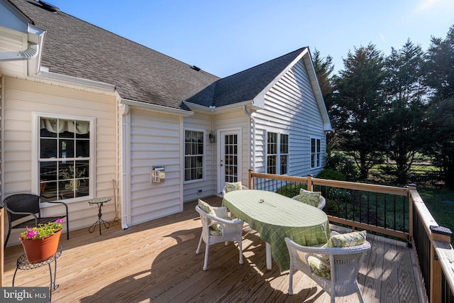 wooden terrace with outdoor dining area