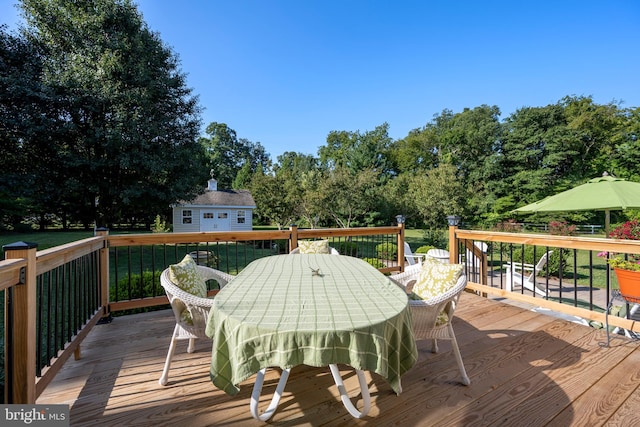 wooden deck with an outdoor structure