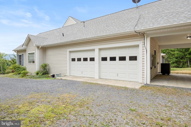 view of side of property featuring a garage