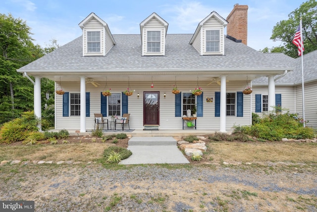 cape cod house with a porch