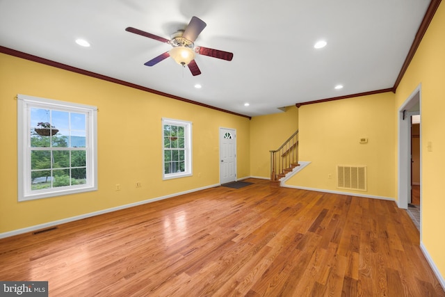 interior space featuring light hardwood / wood-style floors, ceiling fan, and a healthy amount of sunlight