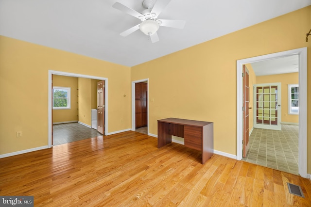 spare room featuring ceiling fan and light hardwood / wood-style floors