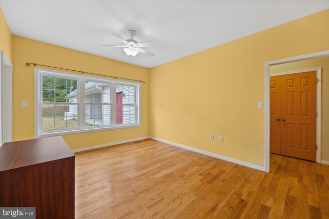 interior space with ceiling fan and light hardwood / wood-style flooring