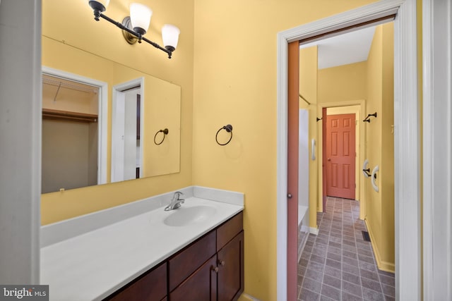 bathroom with tile patterned flooring and vanity