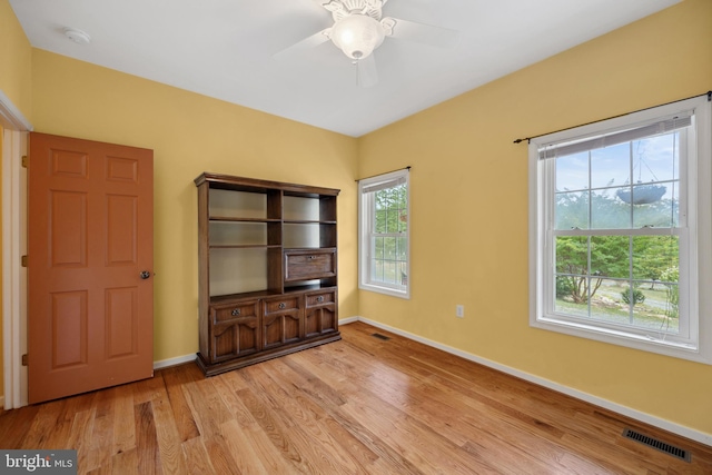 unfurnished bedroom featuring ceiling fan and light wood-type flooring