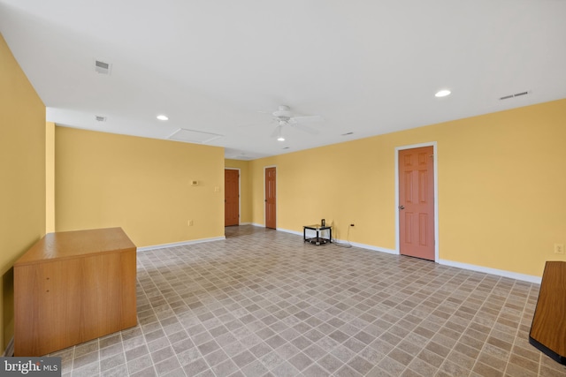 empty room featuring ceiling fan and light tile patterned flooring