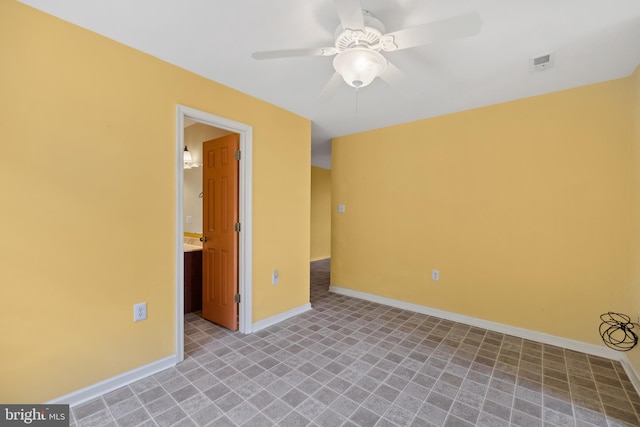 unfurnished room featuring ceiling fan and light tile patterned floors