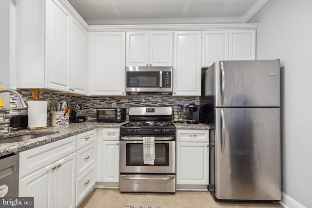 kitchen featuring sink, white cabinets, and appliances with stainless steel finishes