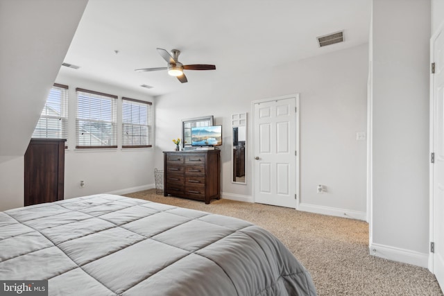 bedroom with light colored carpet and ceiling fan