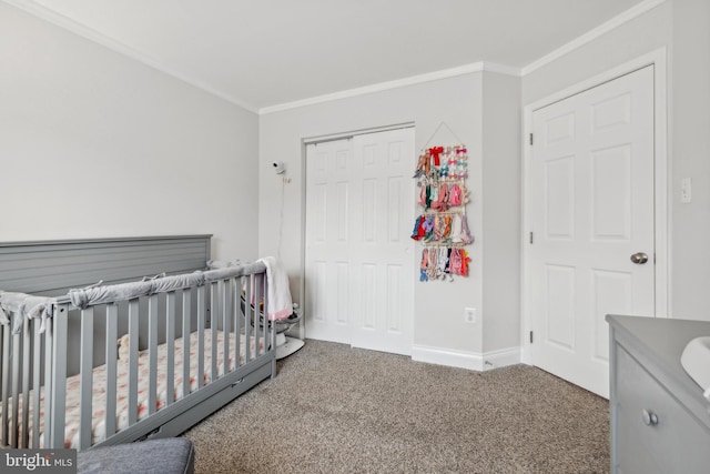 bedroom featuring a closet, carpet floors, a nursery area, and ornamental molding