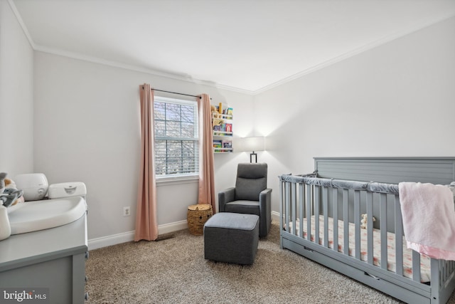 carpeted bedroom featuring a crib and crown molding