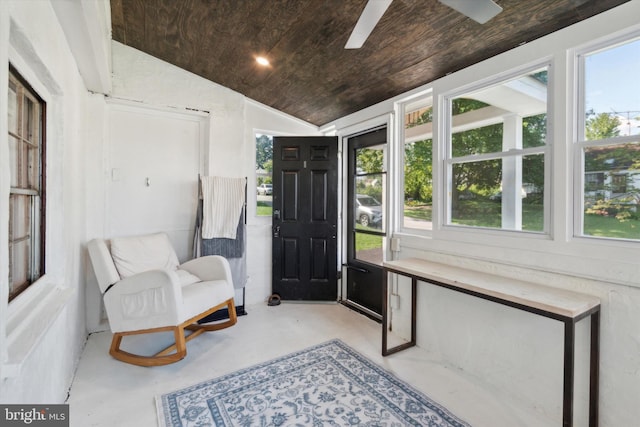 sunroom / solarium with wooden ceiling, plenty of natural light, ceiling fan, and lofted ceiling