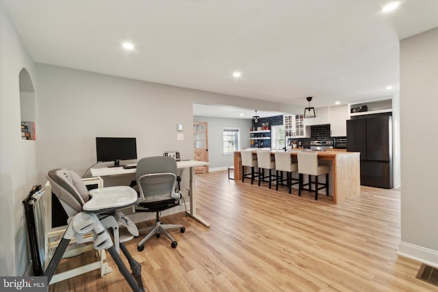 home office featuring light wood-type flooring