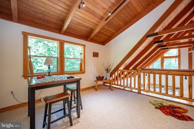 interior space with vaulted ceiling with beams, wooden ceiling, rail lighting, and baseboards