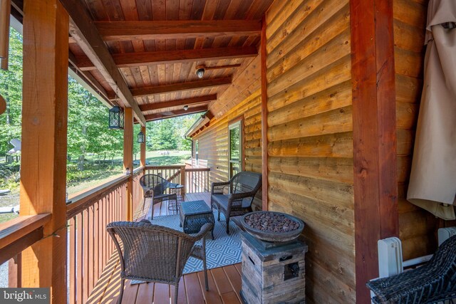 view of home's exterior featuring a yard and a deck