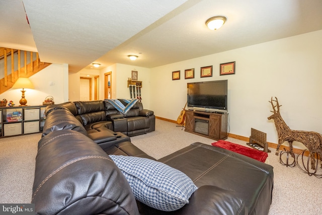 living area featuring stairs, carpet, and baseboards