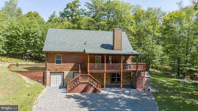 log-style house with a deck, a garage, stairs, stone siding, and a front lawn