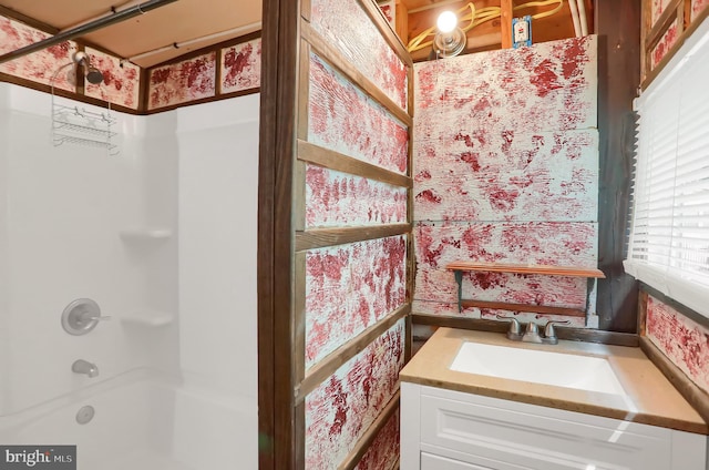 bathroom with washtub / shower combination and vanity