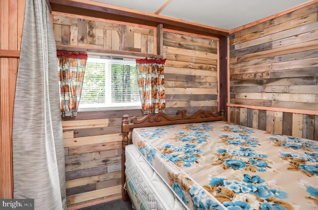 unfurnished bedroom with wooden walls