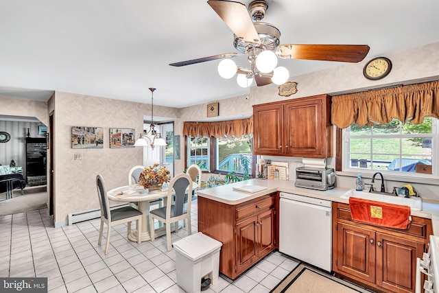 kitchen with light tile patterned floors, plenty of natural light, white dishwasher, and ceiling fan