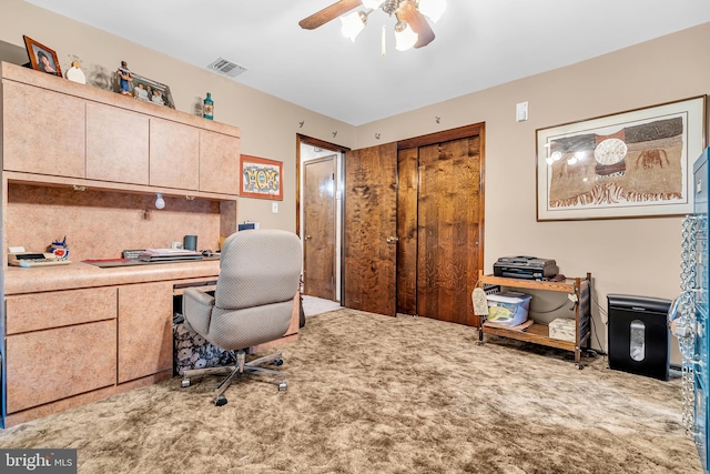 office with carpet flooring and ceiling fan