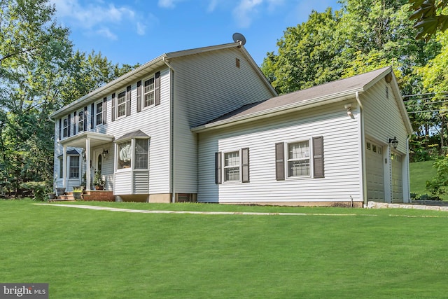 colonial house with a garage and a front yard